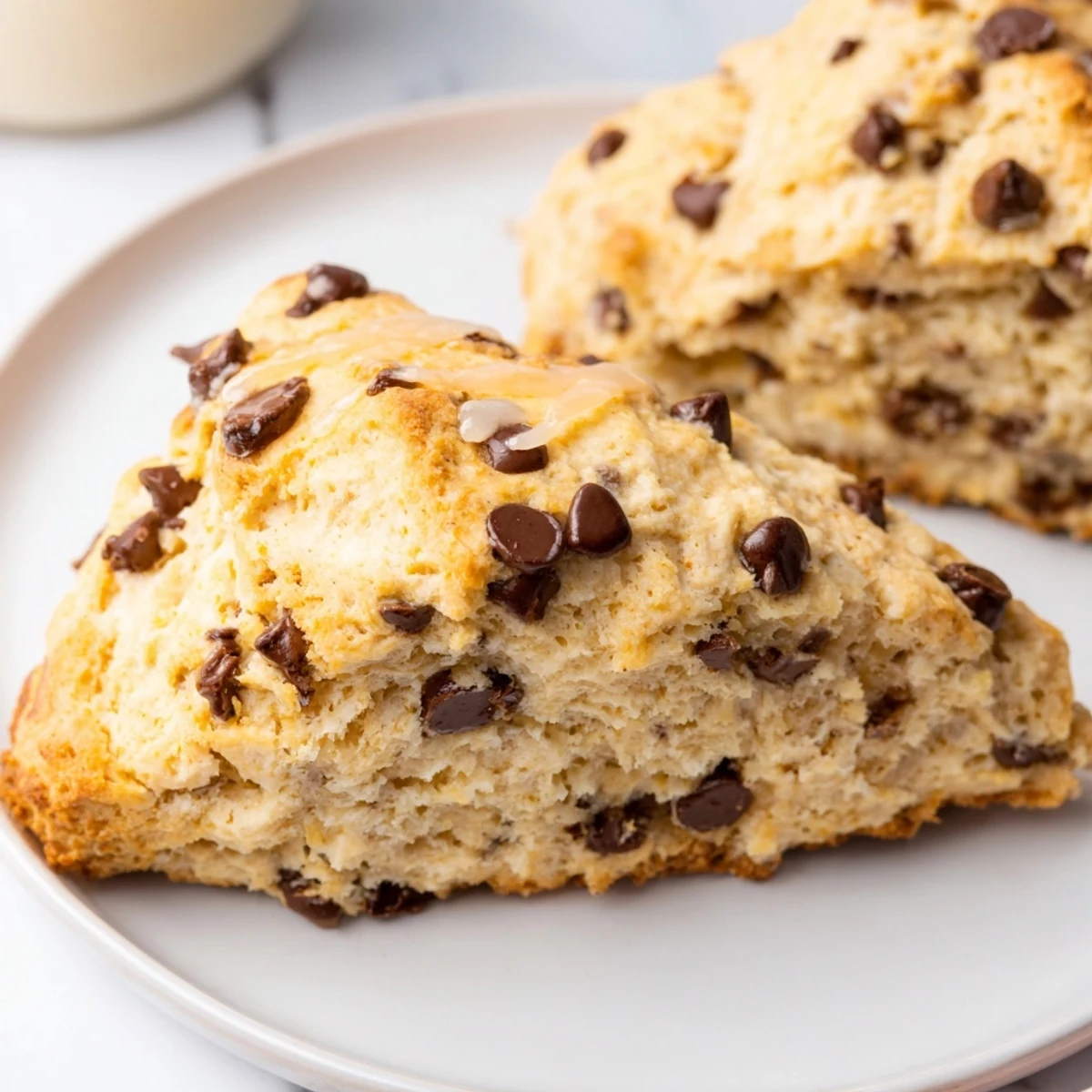 Golden-brown chocolate chip scones, fresh from the oven, ready for a delicious breakfast.