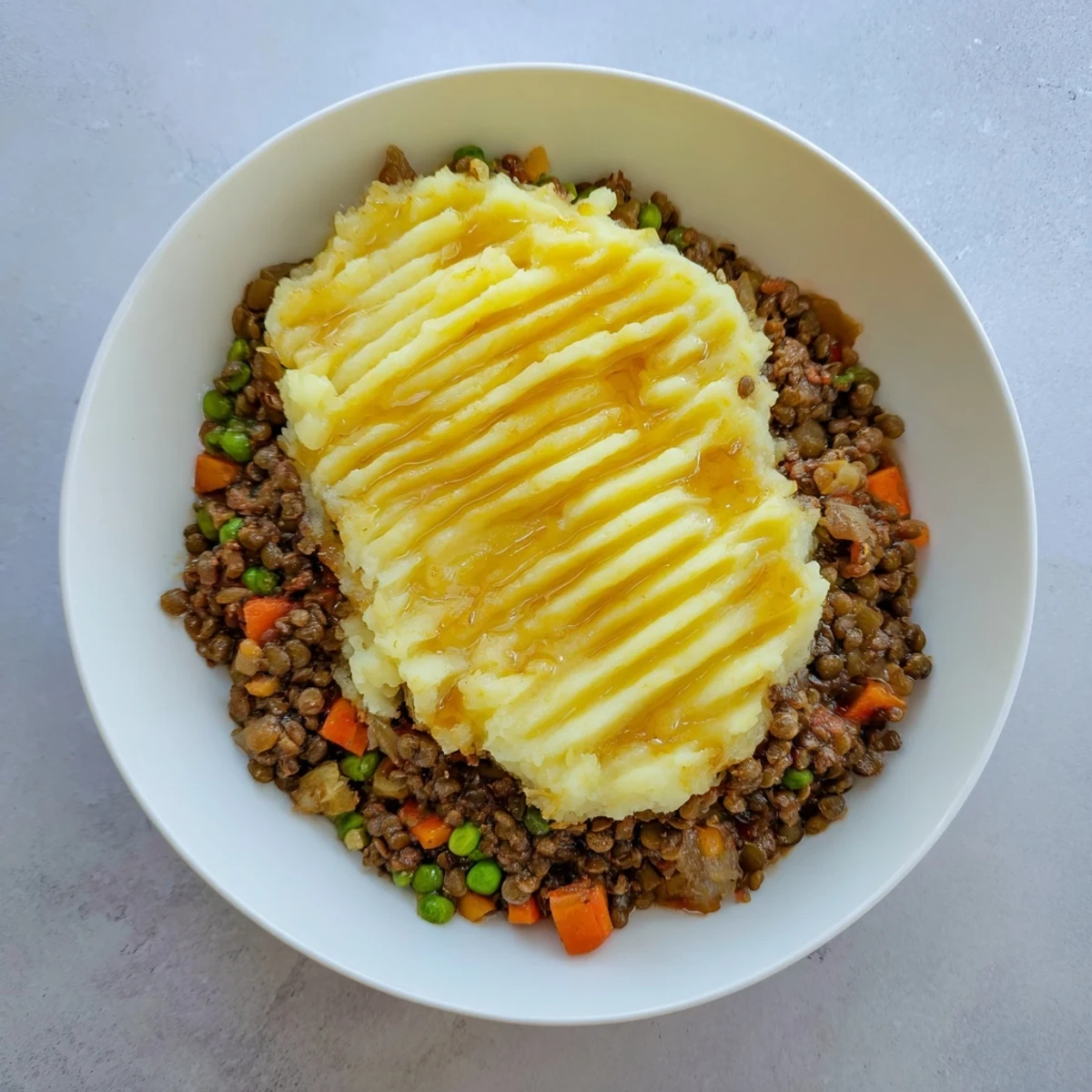 Savory Lentil Shepherd's Pie: a bubbling, golden crust atop a savory lentil and vegetable filling.