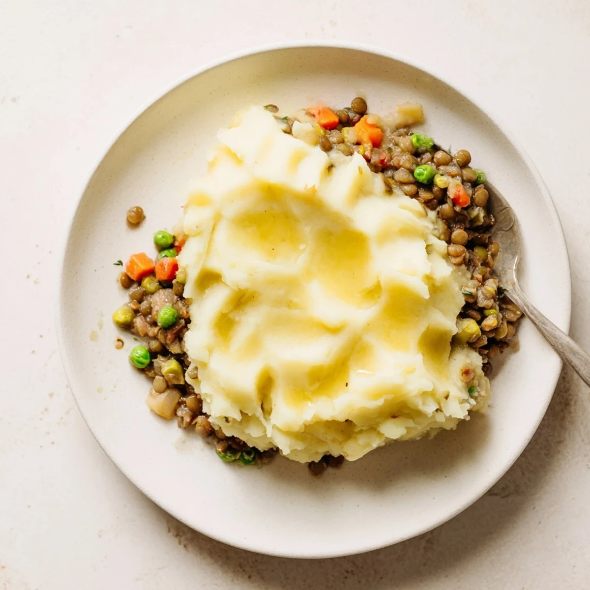 Warm, comforting image of a freshly baked Savory Lentil Shepherd's Pie, ready to serve and enjoy.