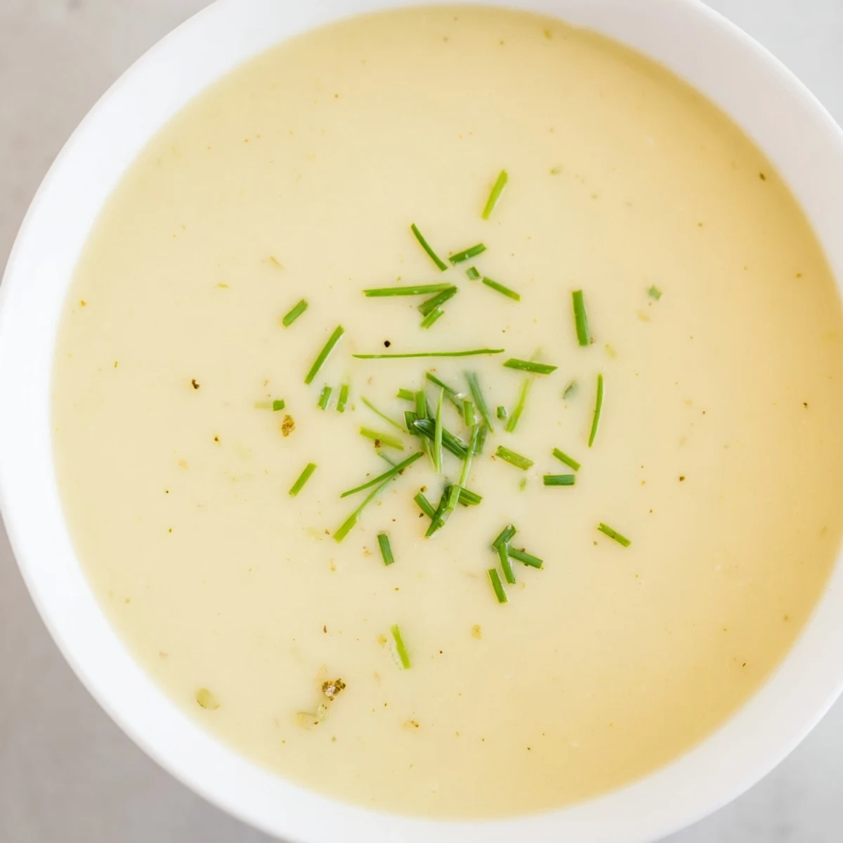 Thick and smooth texture described in this savory creamy potato leek soup recipe photo.