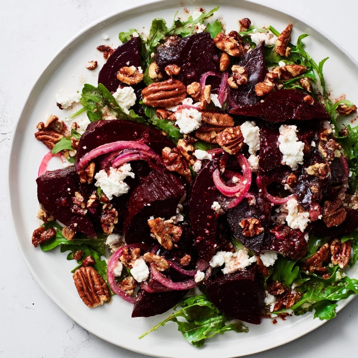 Vibrant Roasted Beet and Feta Salad, showcasing tender beets, creamy feta, and a zesty vinaigrette dressing.