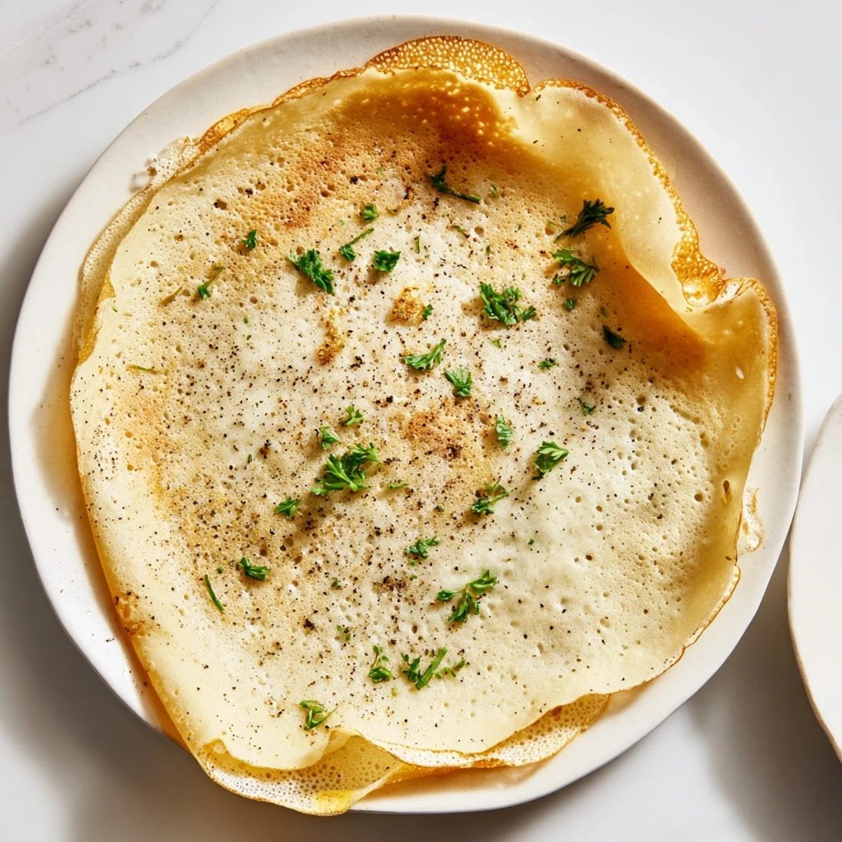 Perfectly thin Savory Crepe Shells, slightly crispy around the edges, perfect for a French-inspired meal.