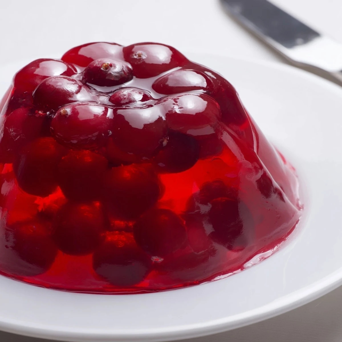 Brightly colored Cranberry Jelly Mold: the smooth, jiggly texture promises a sweet-tart flavor experience.