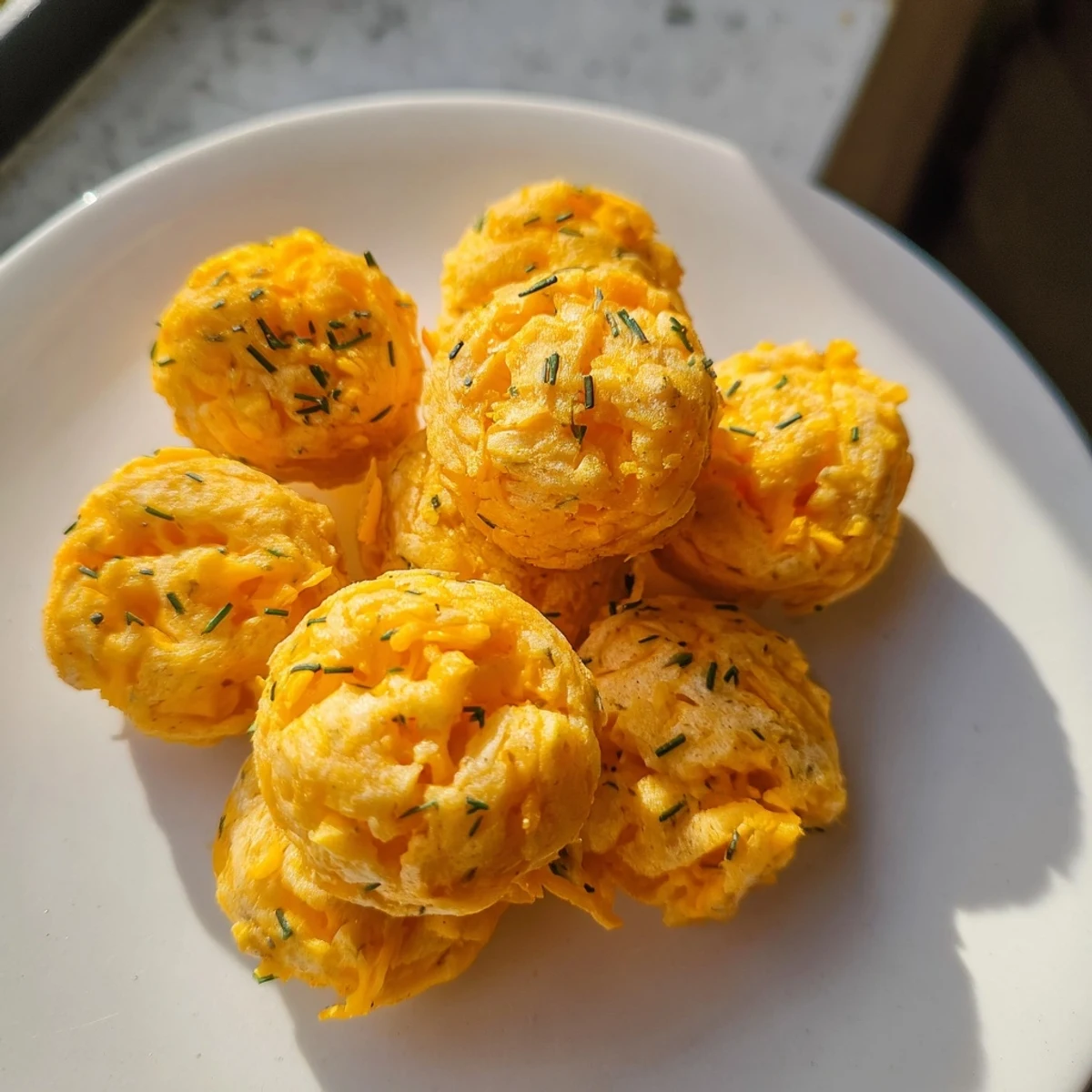 Warm, cheesy Savory Snack Bites, baked to crisp perfection with herbs visible, ready to serve.