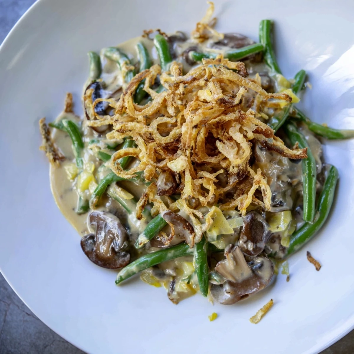 Family-style Green Bean Casserole baked until bubbly, with tender beans and savory mushrooms in every bite.