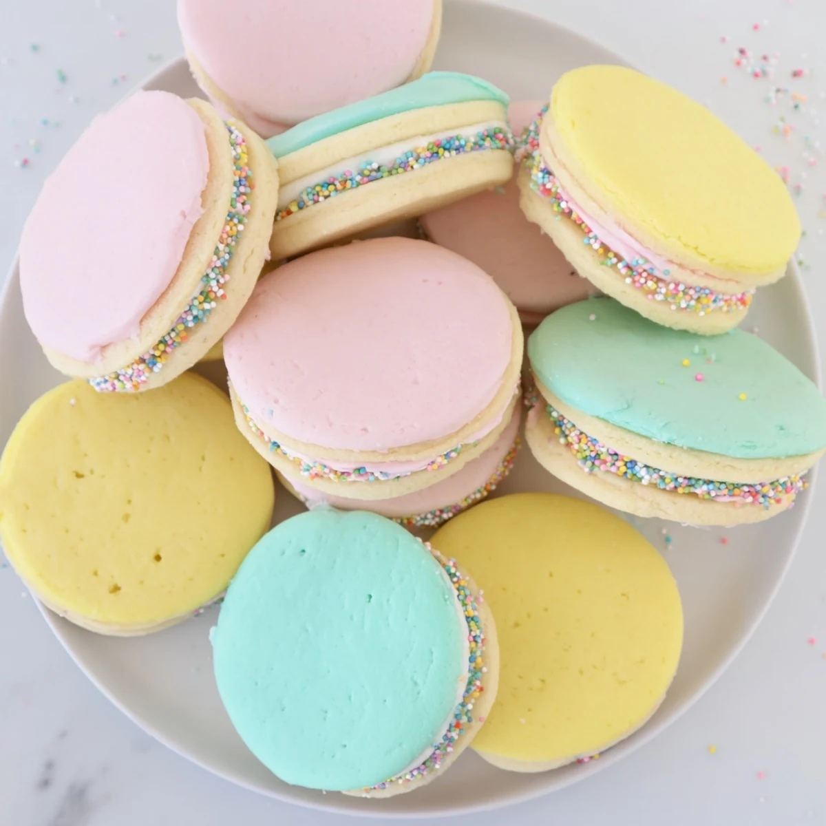 Soft, buttery Pastel Sugar Cookie Sandwiches with pastel buttercream swirls, perfect for festive afternoon tea.