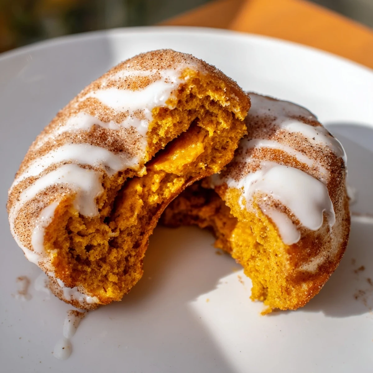 Warm fried donuts made from fluffy biscuit dough filled with spiced pumpkin mixture