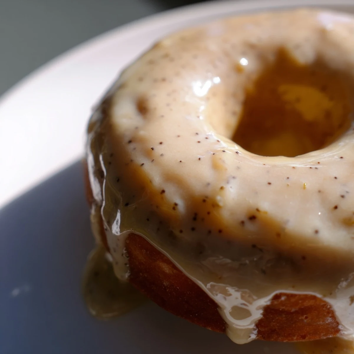 Batch of freshly baked Earl Grey mochi donuts topped with vanilla glaze