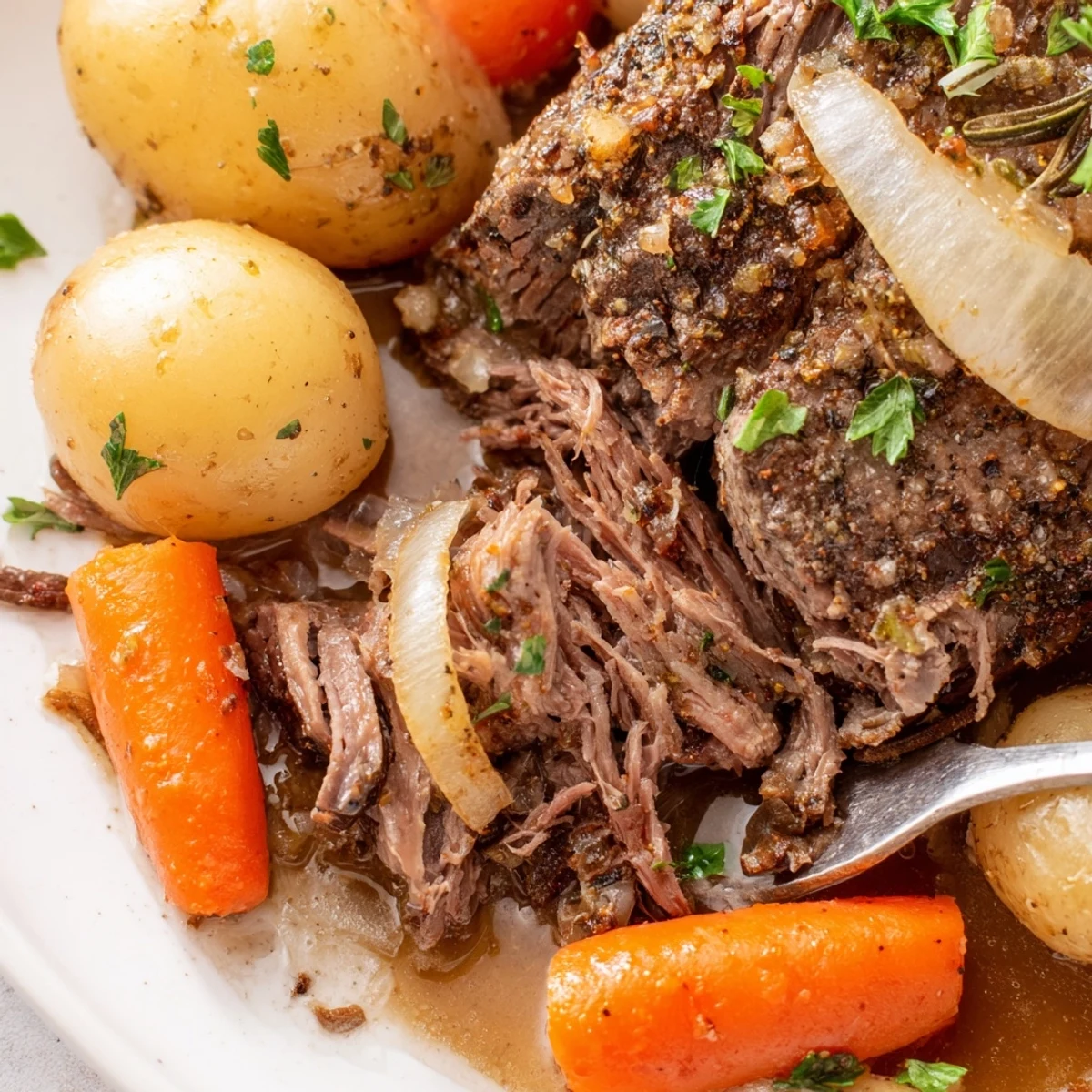 Comforting slow cooker steak and potatoes meal with fork-tender beef, baby potatoes, and vegetables cooked low and slow for six hours