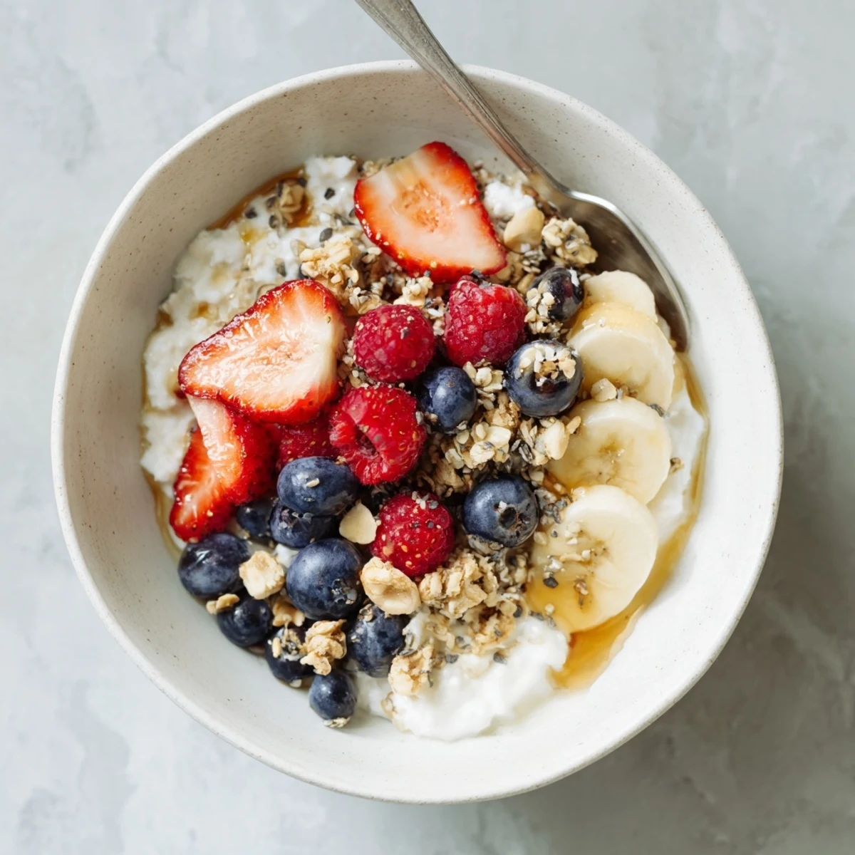 Cottage Cheese Breakfast Bowl with creamy curds, juicy berries, crunchy granola, honey