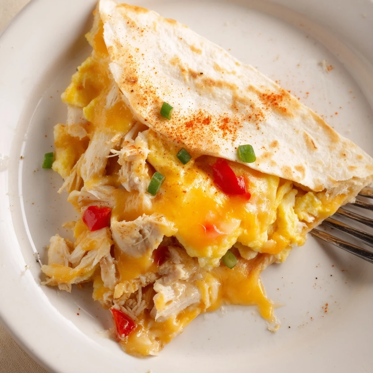 Chicken Breakfast Quesadilla with golden crisp tortilla, melty cheese, and scrambled eggs