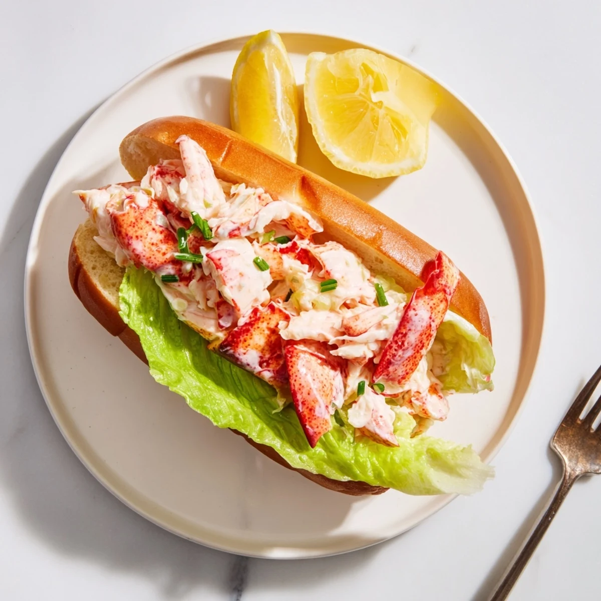 Golden buttery Maine style lobster rolls piled high with tender sweet lobster meat in toasted split top buns