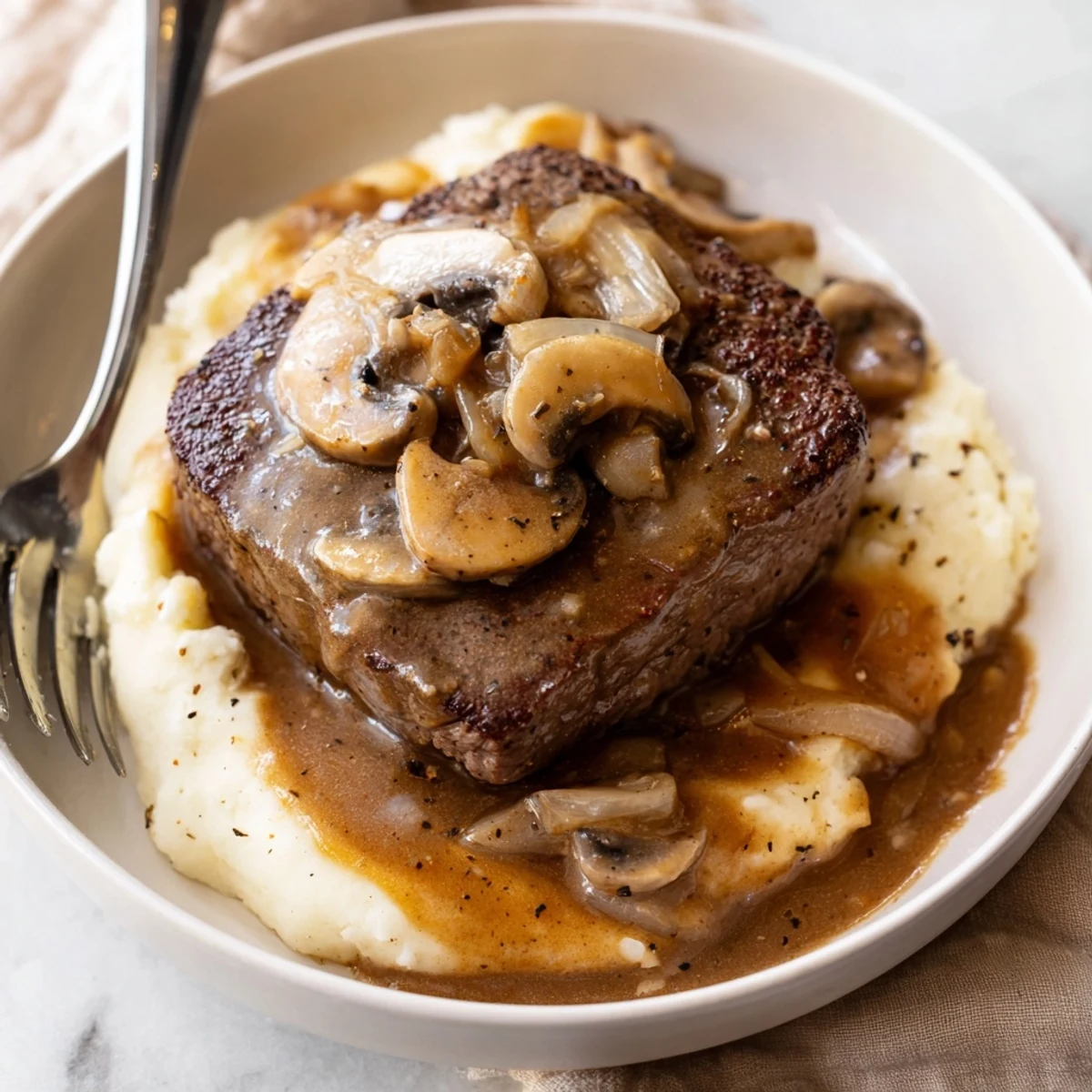 Hearty Country Style Smothered Cube Steak Recipe richly sauced fork tender and steaming
